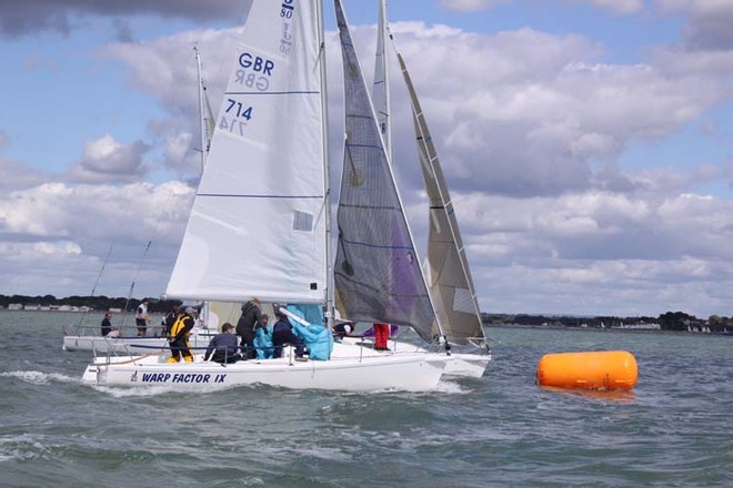 Line abreast at the leeward mark © Eddie Mays - copyright http://www.eddiemays.com